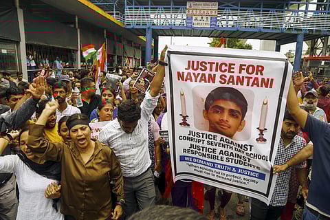 People take part in a protest rally demanding justice for a class 10 student of a private school who was allegedly murdered by his junior.
