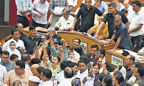 AAP councillors protest during a house meeting of MCD on Thursday.
