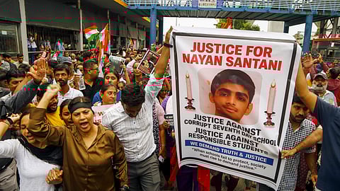 People take part in a protest rally demanding justice for a class 10 student of a private school who was allegedly murdered by his junior following a minor scuffle, in Ahmedabad, Thursday, Aug. 21, 2025