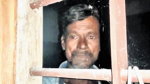 Vellayan seen locked inside a room at the farm stay in Muthalamada