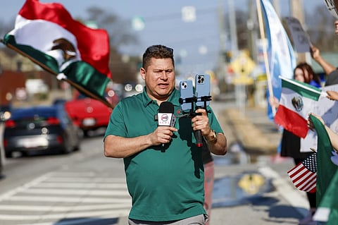 Mario Guevara, the metro Atlanta-based Spanish-language reporter, covers a protest against immigration enforcement on Buford Highway, Ga., on Saturday, Feb. 1, 2025.