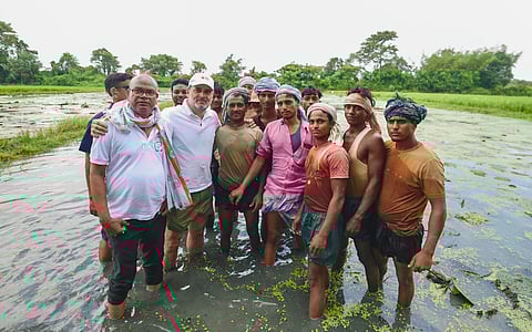 In this image posted on Aug. 23, 2025, LoP in the Lok Sabha Rahul Gandhi during an interaction with makhana farmers, in Bihar.