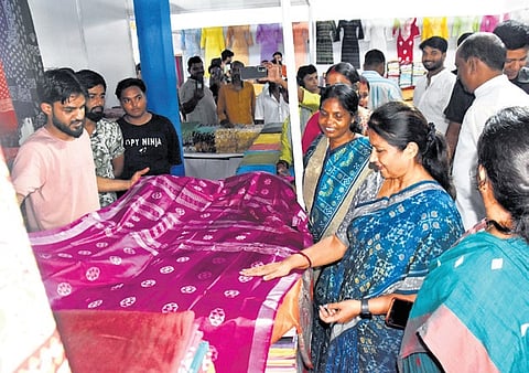 Visitors check out sarees at a stall at the Cottonfab-exhibition and sale at Unit-III Exhibition Ground, on Saturday.