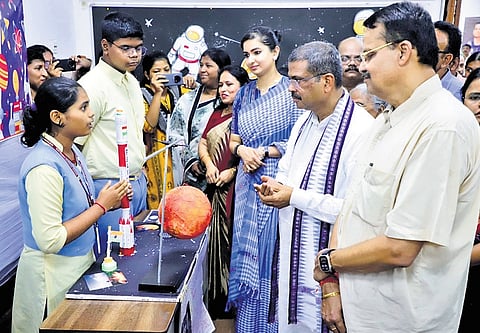 Pradhan, Cuttack MP Bhartruhari Mahtab and Barabati-Cuttack MLA Sofia Firdous interacting with a student at Ravenshaw Collegiate School during the Science Fair