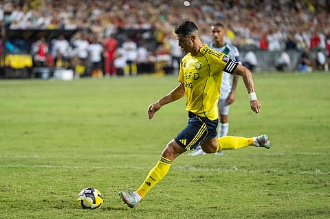 Al Nassr's Cristiano Ronaldo scores a goal with a penalty kick during the Saudi Super Cup final soccer match between Al Ahli and Al Nassr at the Hong Kong Stadium in Hong Kong, Saturday, Aug. 23, 2025.
