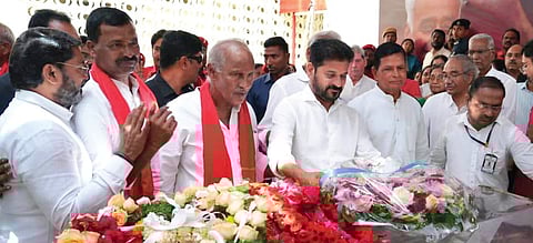 Chief Minister A Revanth Reddy pays floral tributes to the mortal remains of Suravaram Sudhakar Reddy at the CPI state office, Makdoom Bhavan in Hyderabad
