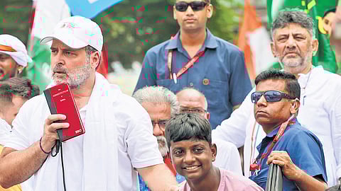 LoP in Lok Sabha Rahul Gandhi addresses a gathering at his ‘Voter Adhikar Yatra’ in Araria, Bihar, on Sunday. Karnataka Deputy CM DK Shivakumar is also seen.