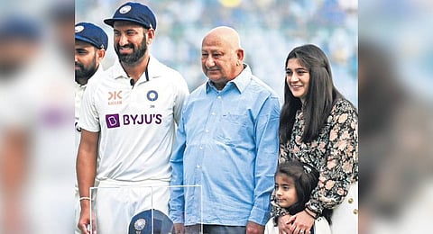 Pujara with his father Arvind, wife Puja Pabari and daughter Aditi during his 100th Test in February 2023.