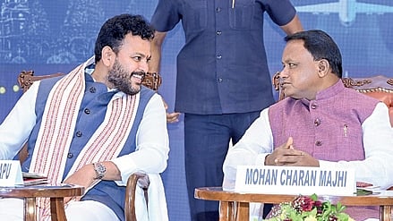 CM Mohan Majhi and Union Minister Kinjarapu R Naidu sharing a lighter moment at the conference