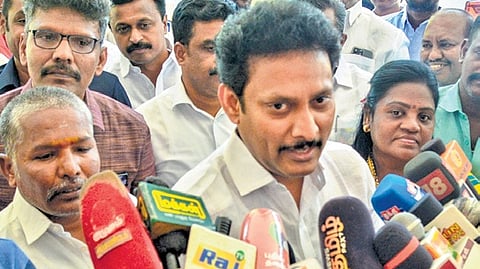Minister Anbil Mahesh talking to media persons.