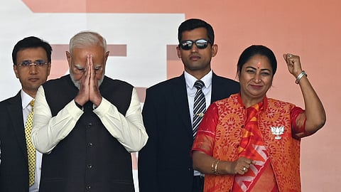 Prime Minister Narendra Modi with newly sworn-in Delhi Chief Minister Rekha Gupta during the oath ceremony at Ramlila Maidan, in New Delhi, Thursday, Feb. 20, 2025.