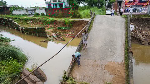 A portion of a bridge damaged following heavy rainfall, in Jammu, Monday, Aug. 25, 2025.