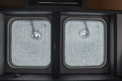 A view of bullet-drilled windows of the MV Ocean Viking, search and rescue vessel chartered by non profit group nonprofit SOS Mediterranee, which according to the organisation, was fired by the Libyan Coast Guard, approximately 40 Nautical Miles north of the Libyan coast, Sunday, Aug 24, 2025.