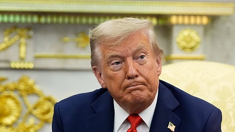 US President Donald Trump listens during a meeting in the Oval Office of the White House, Monday, Aug. 25, 2025, in Washington.
