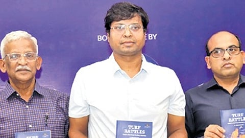 Dilip Tirkey along with author K Arumugam (left) at the book launch.