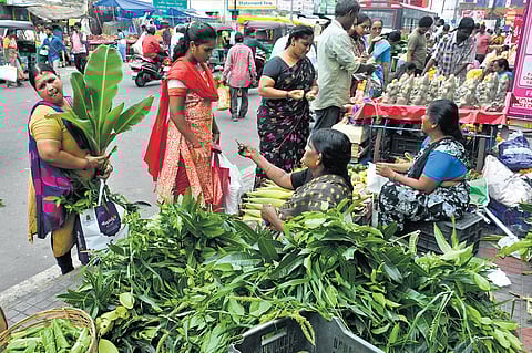 People purchasing pooja material on the eve of Ganesh Chaturthi at One Town in Vijayawada