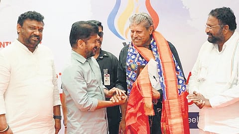 Chief Minister A Revanth Reddy greets former India cricket captain Kapil Dev