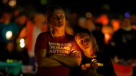 People gather at a vigil at Lynnhurst Park after a shooting at the Annunciation Catholic School Wednesday, Aug. 27, 2025, in Minneapolis.