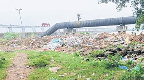 Garbage lying scattered along Mahanadi riverbank near Jobra Park in Cuttack