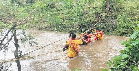 Personnel from Utnoor fire station rescue two persons stranded in Inka village, Adilabad district on Thursday