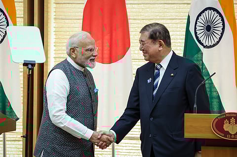 Prime Minister Narendra Modi, left, and Japan's Prime Minister Shigeru Ishiba shake hands during a joint press conference in Tokyo, Japan, Aug. 29, 2025.