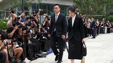 FILE - Kim Keon Hee, right, the wife of South Korea's ousted former President Yoon Suk Yeol, arrives at the special prosecutor's office in Seoul, South Korea, on Aug. 6, 2025