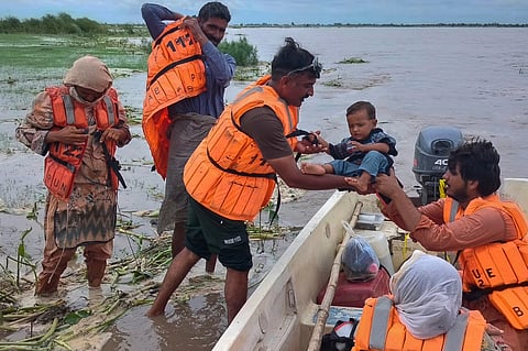 Rescue workers evacuate villagers from a low-lying area due to rising water level in the Sutlej River following neighbouring India released water from overflowing dams, in Bahawalnagar a district in Pakistan's Punjab province.
