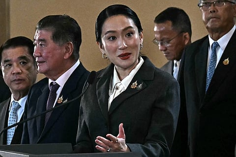 Thailand's sacked prime minister Paetongtarn Shinawatra (C) takes part in a press conference at Government House after her dismissal by the Constitutional Court in Bangkok on August 29, 2025.
