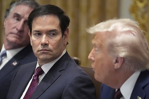 President Donald Trump speaks during a cabinet meeting, Tuesday, Aug. 26, 2025, at the White House in Washington, as from left, Secretary of Interior Doug Burgum and Secretary of State Marco Rubio, look on.