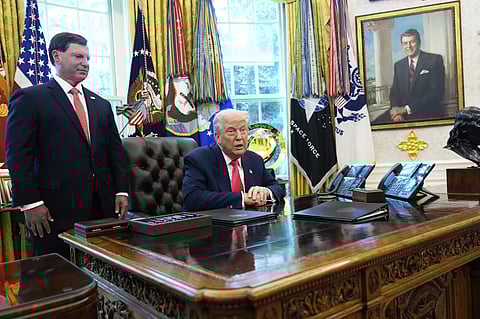 Social Security Commissioner Frank Bisignano, left, listens as President Donald Trump speaks during event in the Oval Office to mark the 90th anniversary of the Social Security Act, Thursday, Aug. 14, 2025, in Washington.