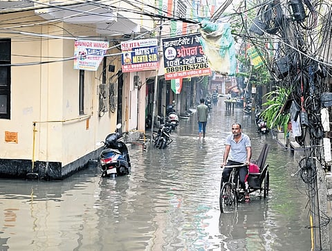 The downpour led to severe waterlogging on arterial roads, with commuters struggling through inundated streets, and some locals even wading and swimming through knee-deep water.