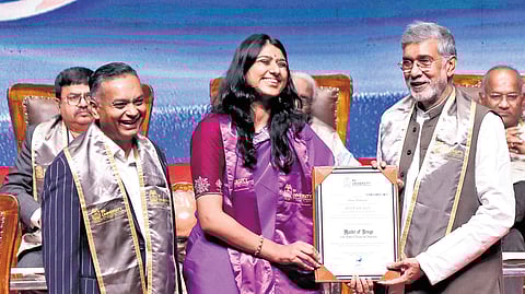 Nobel Peace Laureate Kailash Satyarthi presents a Master of Design degree certificate to Tulasi Mukunda during the convocation ceremony of RV University in Jayanagar on Saturday