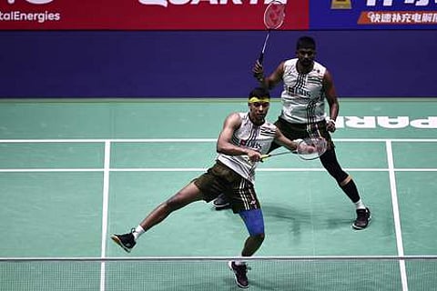 Chirag Shetty (L) and India's Satwiksairaj Rankireddy play against China's Liu Yi and China's Chen Boyang in the men's double semi-final match
