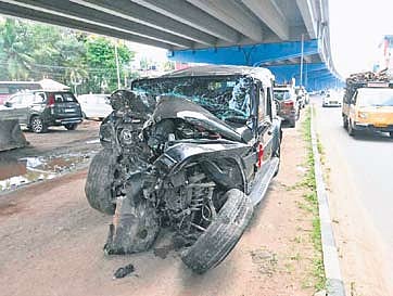 The mangled remains of the vehicle that crashed into a pillar at Kazhakkoottam
on Sunday morning