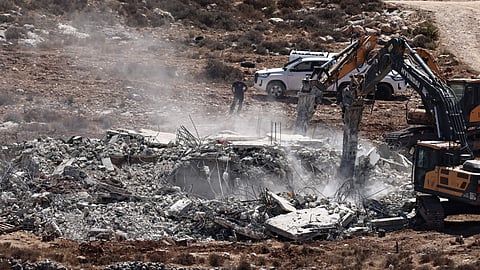 Israeli military bulldozers demolish a Palestinian-owned house in Shuqba village, west of Ramallah, in the occupied West Bank on September 1, 2025.