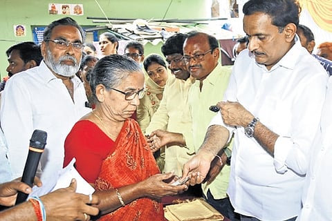 Vijayawada MP Kesineni Sivanath distributes pension to beneficiaries on Monday.