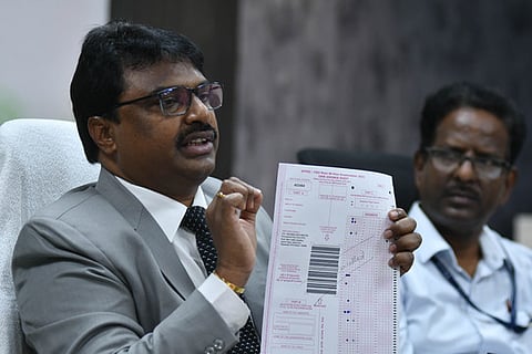 APPSC secretary P Raja Babu addressing the media during the press conference in Vijayawada on Monday.