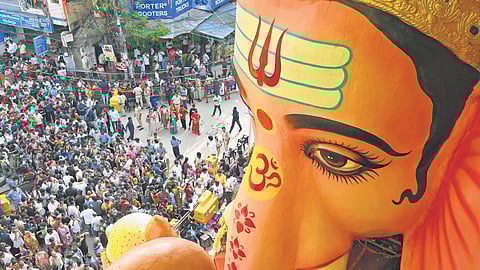 A multitude of devotees offer prayers to the 69-foot-tall Lord Ganesha idol in Khairatabad, Hyderabad