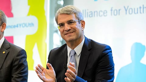 France’s Laurent Freixe, Executive Vice President in the Nestle Headquarters, applauds during an event in Vevey, Switzerland, Thursday, Sept. 18, 2014.