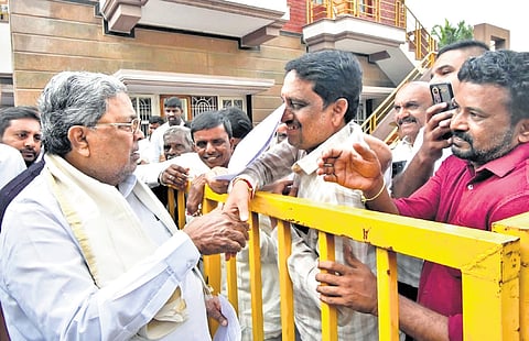Chief Minister Siddaramaiah interacts with the public outside his Mysuru residence as part of Janata Darshan on Tuesday.