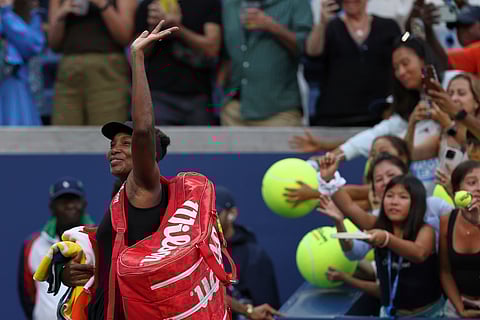 Venus Williams, of the United States, acknowledges the crowd after losing quarterfinal doubles match with parter Leylah Fernandez, of Canada, at the U.S. Open tennis championships, Tuesday, Sept. 2, 2025, in New York.