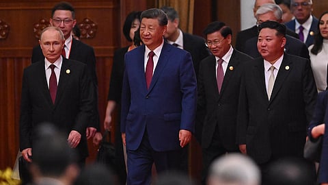 China’s President Xi Jinping (C), North Korea’s leader Kim Jong Un (R) and Russia’s President Vladimir Putin (L) arrive for a reception in the Great Hall of the People, following a military parade marking the 80th anniversary of victory over Japan and the end of World War II, in Beijing on September 3, 2025