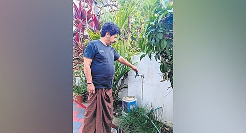 Vayalar Madhavankutty, a resident of Sasthamangalam, showing the
dried-up water