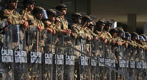 California National Guard are positioned at the Federal Building, June 10, 2025, in downtown Los Angeles.