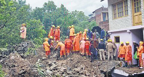 NDRF and police personnel conduct a search and rescue operation after heavy rainfall triggers landslide in Inner Akhara bazaar in Himachal Pradesh’s Kullu.