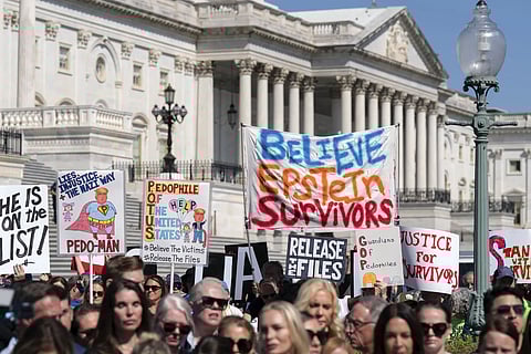Demonstrators hold banners during a news conference at the US Capitol, Wednesday, Sept 3, 2025, in Washington.