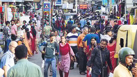 People throng the Broadway market on the eve of Onam