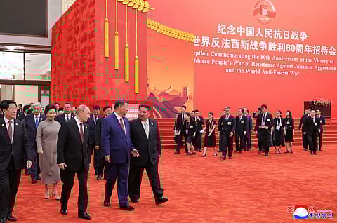 Russian President Vladimir Putin, Chinese President Xi Jinping and North Korean leader Kim Jong Un arrive for a reception marking the 80th anniversary of the end of World War II, at the Great Hall of the People in Beijing.