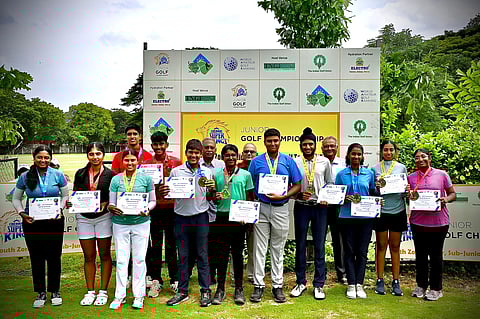 Junior boys and girls with medals at the Cosmopolitan Golf Course on Thursday