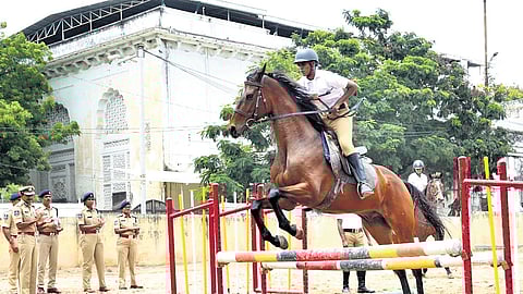 A woman police constable showcasing horse-riding skills at the Goshamahal Mounted Unit on Friday while fellow cops appreciate her.
